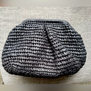 Black raffia crochet clutch bag.